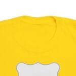 Close-up of a bright yellow T-shirt neckline with a white bone-shaped graphic outlined in blue at the center.