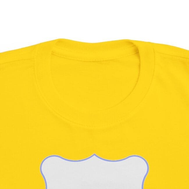 Close-up of a bright yellow T-shirt neckline with a white bone-shaped graphic outlined in blue at the center.
