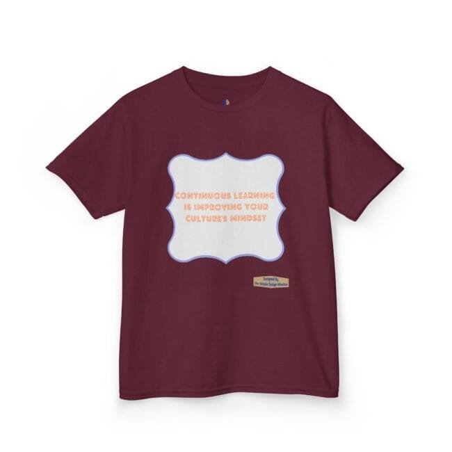 Maroon t-shirt featuring a light blue decorative frame with the quote: 'Continuous learning is improving your culture's mindset' in orange text in the center.