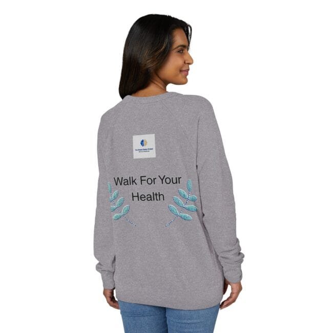 Back view of a woman wearing a gray sweatshirt with the slogan 'Walk For Your Health' and teal embroidered leaves, plus a small square logo on the upper back.