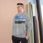 Man wearing a light gray hoodie stands with hands in pockets; the front graphic reads 'Walk For Your Health' over a road scène background in a studio setting.
