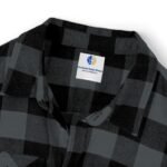 Plaid gray and black shirt with a white square tag reading 'The Simple Design Mindset' on the chest area.