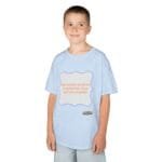 Boy wearing a light-blue T-shirt with a white, purple-framed badge saying 'Continuous learning is improving your culture's mindset'.