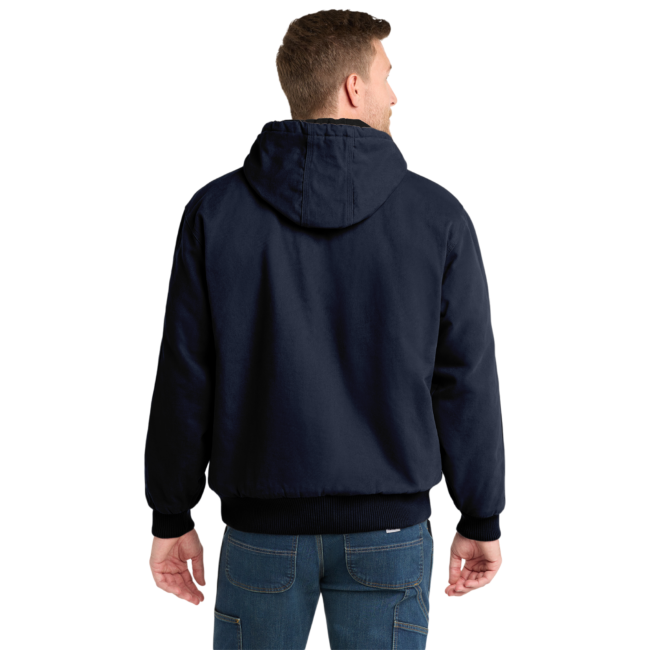 Back view of a man wearing a navy hooded jacket and blue jeans, facing away.