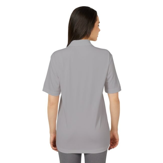 Back view of a person wearing a light gray short-sleeve polo shirt, shown from the shoulders down to hips.