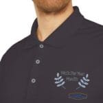 Navy polo shirt with an embroidered 'Walk For Your Health' slogan and blue laurel branches on the left chest.