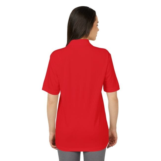 Back view of a person wearing a bright red short-sleeve polo shirt, untucked to the hip area, with a visible collar edge.
