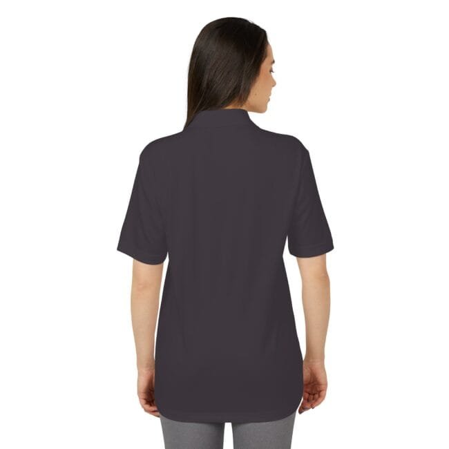 Back view of a woman wearing a dark charcoal polo shirt with short sleeves, hip-length.