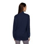 Back view of a woman wearing a navy blue long-sleeve jacket that falls to hip length; small blue loop tag on the left cuff.