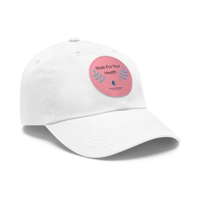 White baseball cap featuring a pink circular patch with the text 'Walk For Your Health' and decorative blue-green leaves.