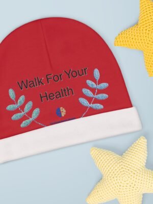 13844876540490088496_2048jpeg Red round booklet with the words 'Walk For Your Health' and blue leaf motifs on a light blue background, with a yellow knitted star shape nearby.