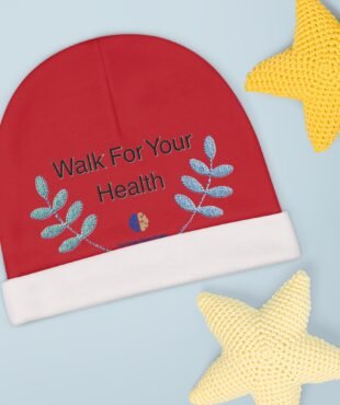 Red round booklet with the words 'Walk For Your Health' and blue leaf motifs on a light blue background, with a yellow knitted star shape nearby.