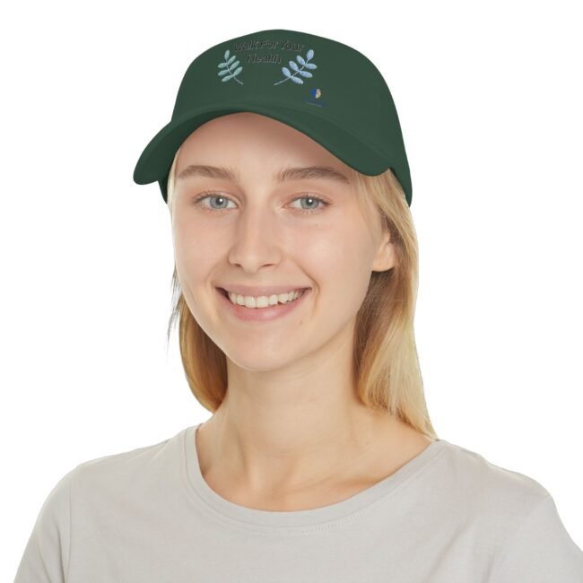 Smiling person wearing a dark green cap with the slogan 'Walk For Your Health' and blue laurel embroidery on the front.