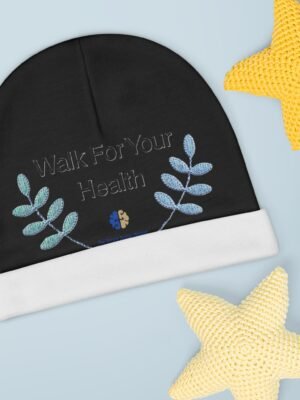 17637037081053005778_2048jpeg Black circular fabric with blue embroidered leaves and the phrase 'Walk For Your Health' on a pale blue background, with a yellow knitted star in the top-right corner.