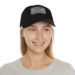 Close-up of a person wearing a black cap with a gray patch that reads 'Walk For Your Health' and decorative blue leaves on the patch.