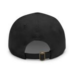 Close-up of a black fabric baseball cap showing the adjustable strap and brass buckle at the back area