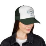 Female wearing a white and green cap with 'Walk For Your Health' logo and leafy design.