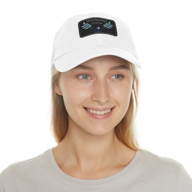 Close-up of a smiling person wearing a white baseball cap with a black patch reading 'Walk For Your Health' on the front.
