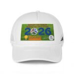White baseball cap with a green sticker reading 'Support our team by respecting each other' and the year 2026, visible on the front panel.