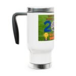 White travel mug with a black handle and a colorful sports-themed sticker on the side showing grass, a large blue number, and trophy graphics, likely for a soccer event.