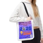 Person wearing a white hoodie with a purple poster draped across their torso reading ‘Support Our Team by Respecting Each Other.’