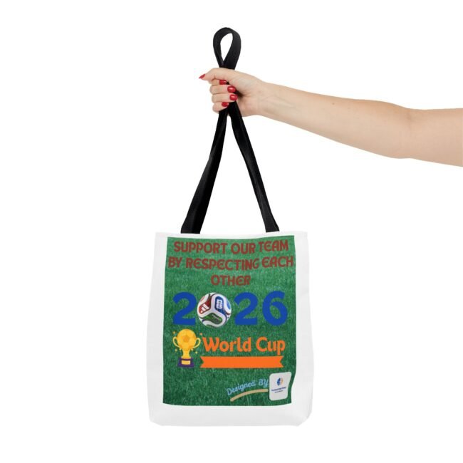 Person gripping a black tote bag strap while the green poster on the bag reads 'Support Our Team by Respecting Each Other'.