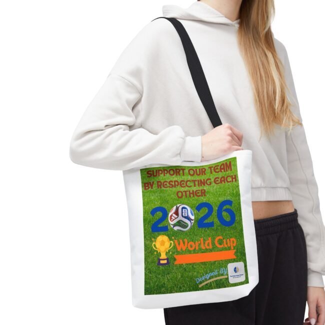 Person wearing a white hoodie carrying a white bag with a green World Cup 2026 poster attached to the strap.