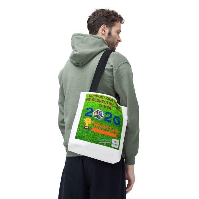 Man wearing a green hoodie, seen from the side, carrying a white bag with a colorful World Cup poster