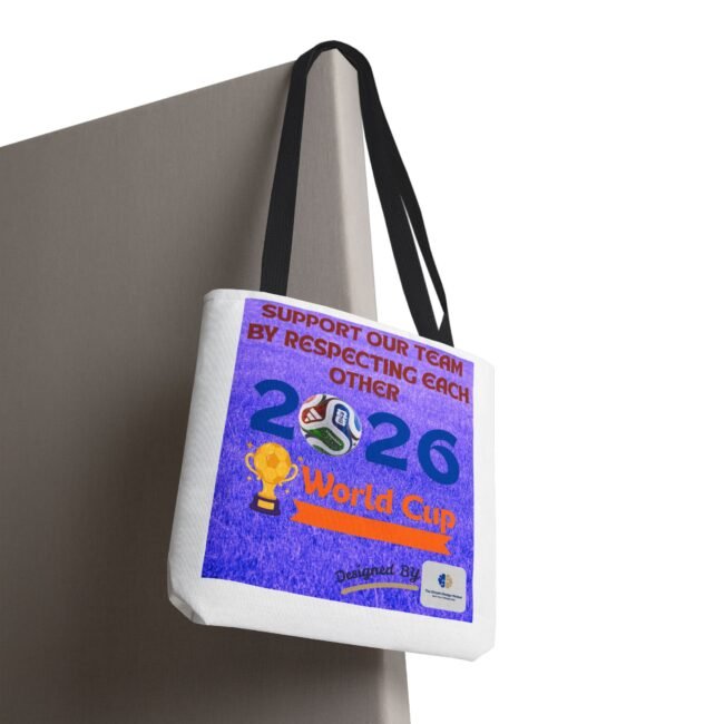White tote bag hanging from a strap with a purple poster design featuring 'World Cup' text visible on the front.
