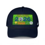 Close-up of a navy baseball cap with a bright green sticker on the front, showing part of the text and designs behind a curved brim.