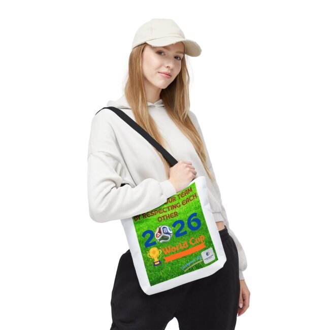 Young woman wearing a white hoodie and cap, holding a bright green race bib over her chest.