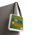 Tote bag with a colorful poster graphic featuring text about supporting a team and World Cup imagery on a green background.
