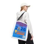 Person wearing a white hoodie and cap, carrying a white tote bag with a blue World Cup poster.
