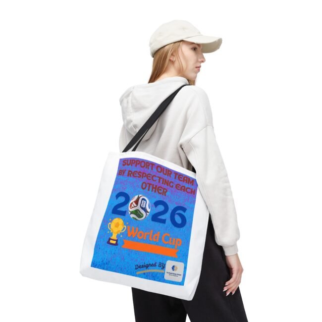 Person wearing a white hoodie and cap, carrying a white tote bag with a blue World Cup poster.