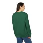 Back view of a person with dark hair wearing a green top and blue jeans, looking to the right.