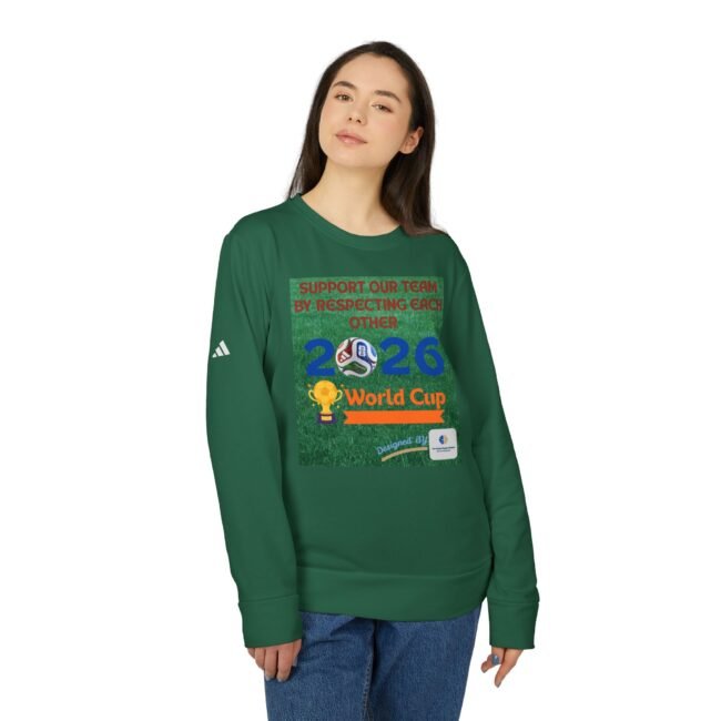 Young woman in a green sweatshirt with a large colorful graphic on the chest, standing against a white background.