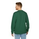 Back view of a man wearing a green long-sleeve shirt and light blue jeans, standing against a white background