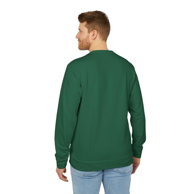 Back view of a man wearing a green long-sleeve shirt and light blue jeans, standing against a white background