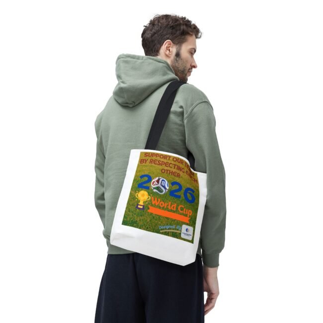 Side-profile of a man in a green hoodie carrying a white tote bag with a colorful poster design visible on it.