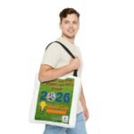 Man walking, carrying a white tote bag with a colorful poster featuring a World Cup 2026 design over his shoulder.