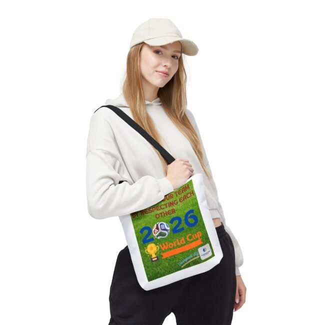 Young woman wearing a white hoodie and cap, with a large green race bib slung over her chest.